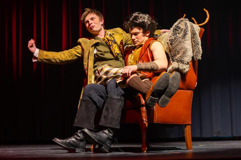 Actors perform onstage